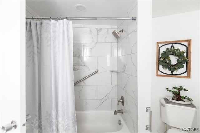 bathroom featuring toilet and shower / tub combo with curtain