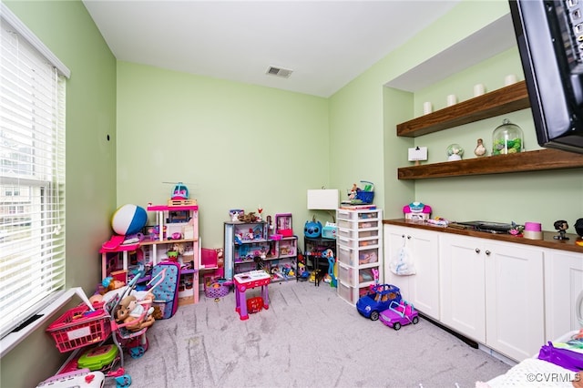 game room with visible vents and carpet floors