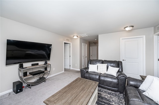 carpeted living room featuring visible vents and baseboards