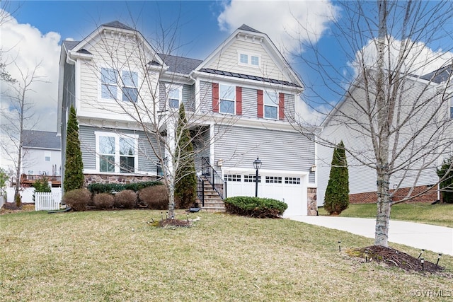 view of front of property with stone siding, driveway, an attached garage, and a front yard