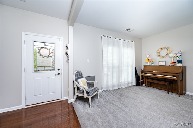 entryway with visible vents, a healthy amount of sunlight, and baseboards