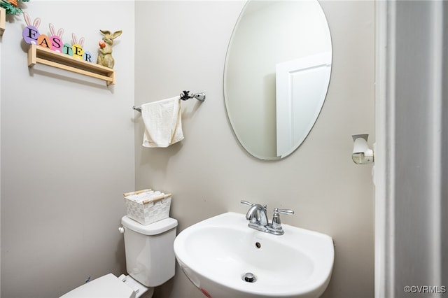 bathroom with a sink and toilet