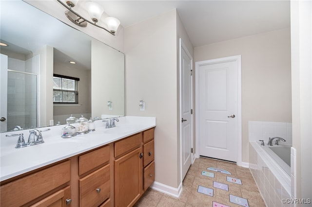 full bathroom with a bath, a shower stall, double vanity, and a sink