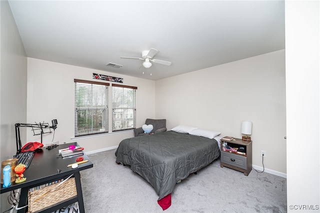 carpeted bedroom with visible vents, ceiling fan, and baseboards