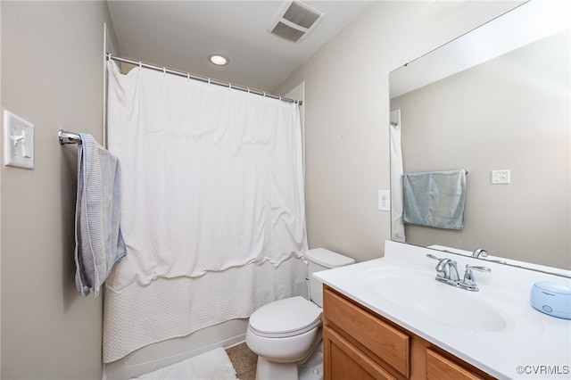 bathroom featuring visible vents, toilet, and vanity