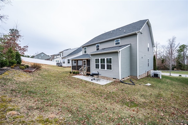 back of house with a patio, a yard, fence, and crawl space