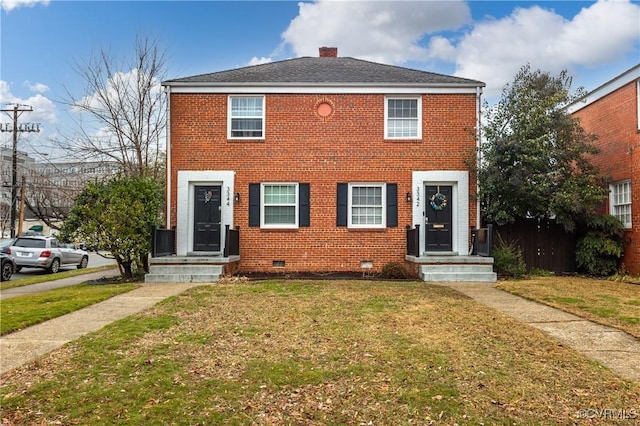 view of front of home with a front lawn