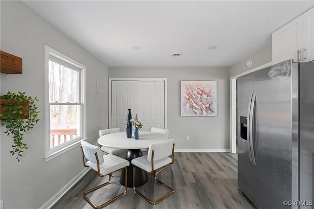 dining room featuring visible vents, baseboards, and dark wood-style flooring