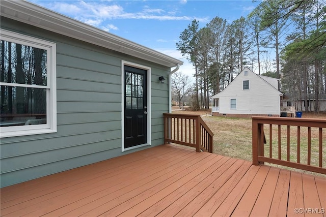 wooden deck with a yard