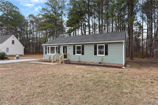 ranch-style home featuring crawl space, a shingled roof, and a front yard