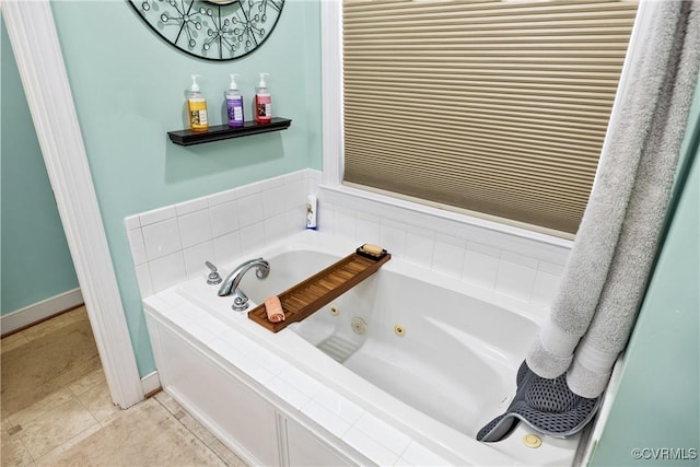 bathroom featuring tile patterned flooring and tiled tub