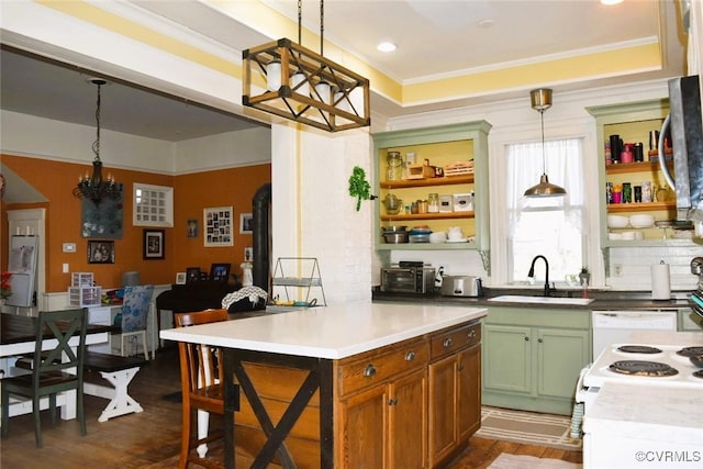 kitchen with a sink, hanging light fixtures, dark wood-style floors, open shelves, and crown molding