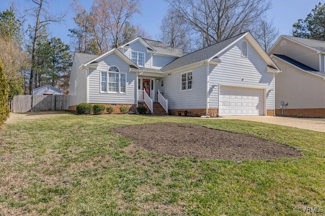 traditional-style house with driveway, fence, a front yard, an attached garage, and crawl space