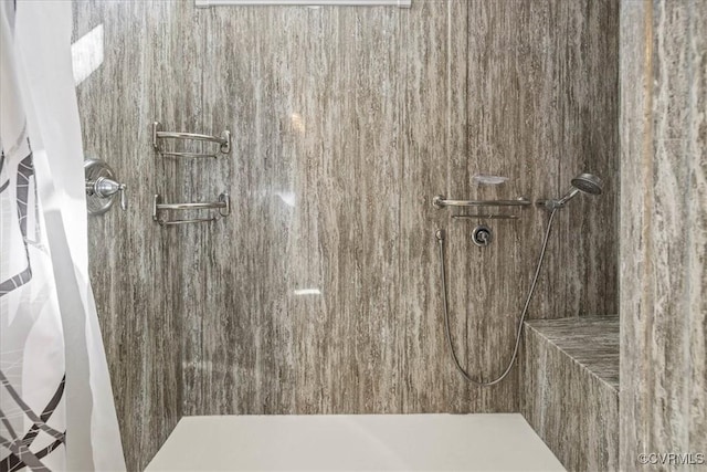 full bathroom with a tile shower