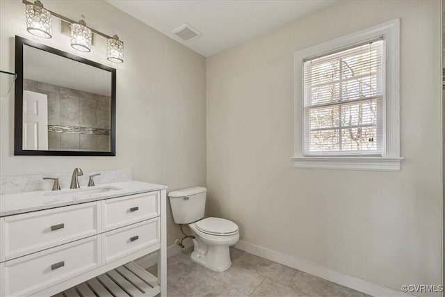 full bath with vanity, visible vents, baseboards, tile patterned flooring, and toilet