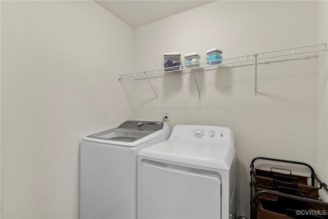 washroom featuring washer and dryer