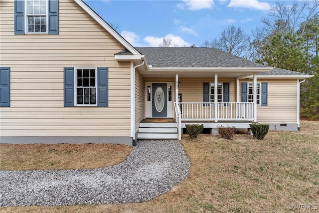 view of front facade with a front lawn and a porch