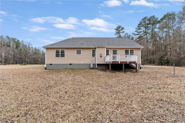 rear view of property with a wooden deck