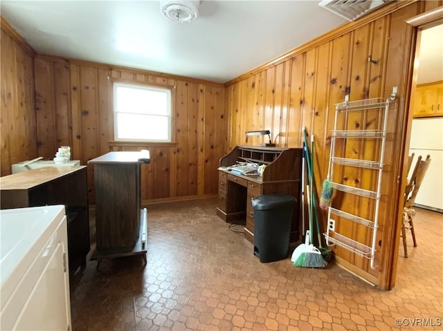 interior space with washer / dryer and wood walls