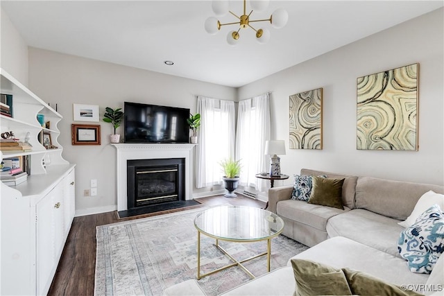 living room with a chandelier and dark hardwood / wood-style floors