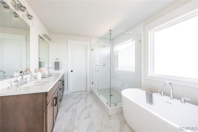 bathroom with shower with separate bathtub and vanity