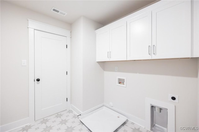 laundry area featuring hookup for a gas dryer, washer hookup, cabinets, and electric dryer hookup