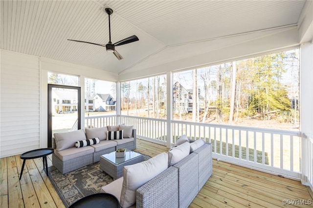 sunroom with lofted ceiling and ceiling fan