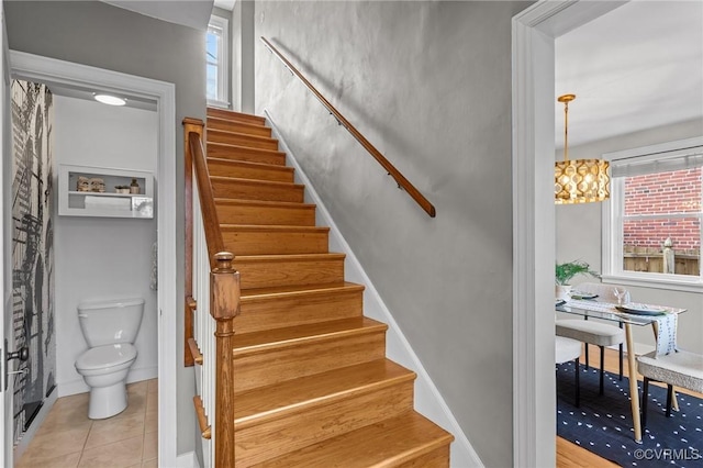 stairway with tile patterned flooring