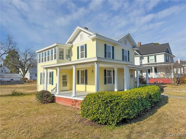 exterior space featuring a yard and a porch