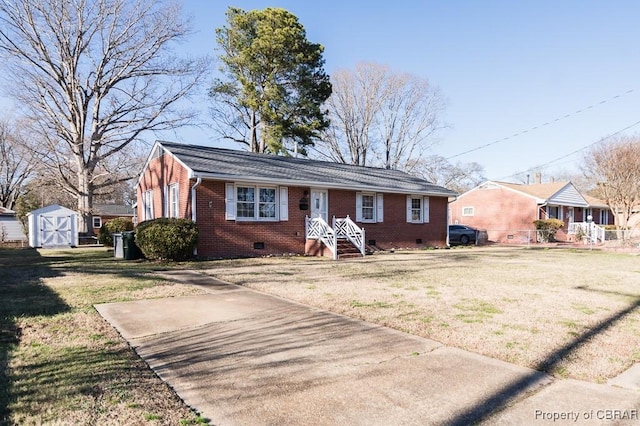 view of front of house with a storage shed and a front yard