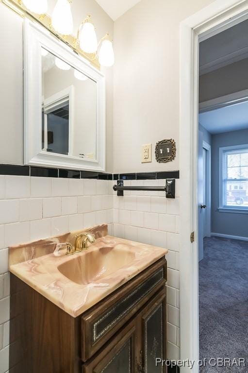 bathroom featuring tile walls and vanity