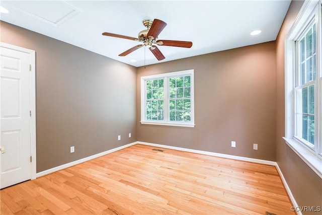 empty room with a ceiling fan, light wood-style flooring, baseboards, visible vents, and recessed lighting