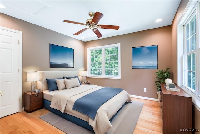 bedroom with baseboards, a ceiling fan, light wood-style flooring, and recessed lighting