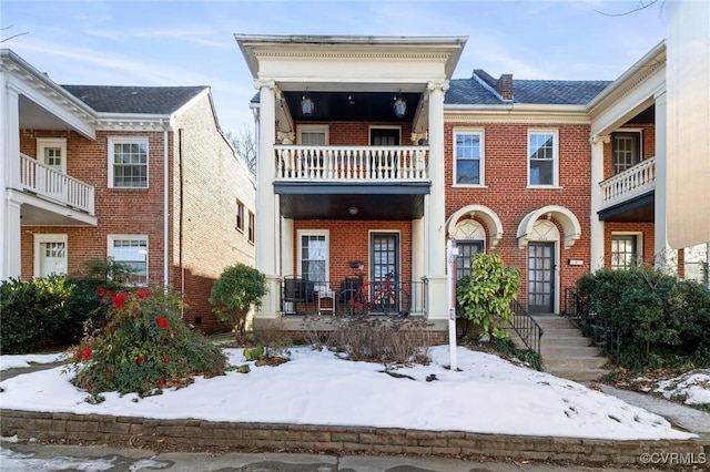 view of front of house with brick siding