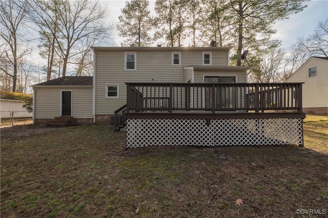 rear view of house featuring a deck