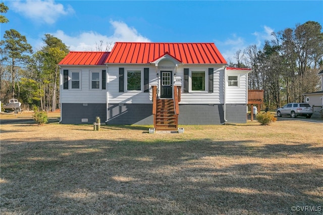 bungalow featuring metal roof, crawl space, a standing seam roof, and a front yard