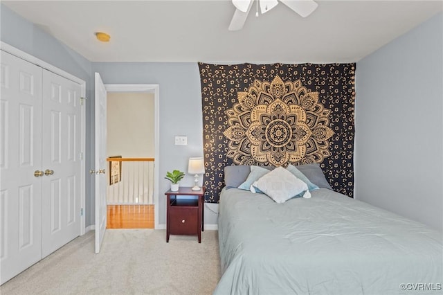 bedroom with carpet floors, a closet, a ceiling fan, and baseboards