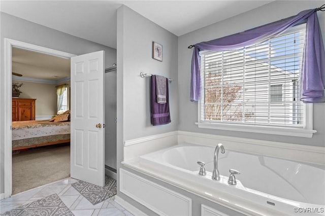 ensuite bathroom featuring a garden tub, ensuite bath, and a stall shower