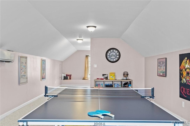 game room featuring lofted ceiling, baseboards, carpet flooring, and a wall mounted air conditioner