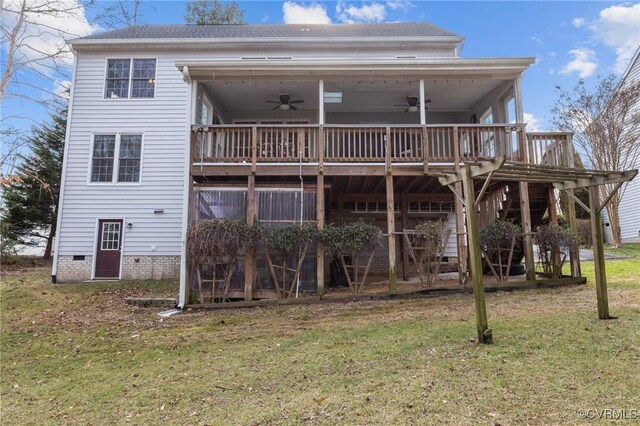 back of house with a ceiling fan, a lawn, a deck, and stairs