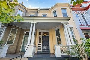 property entrance with mansard roof