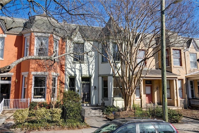 townhome / multi-family property with brick siding