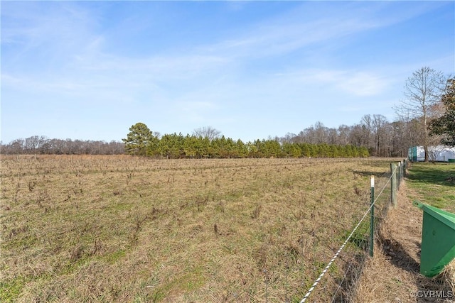 view of yard with a rural view