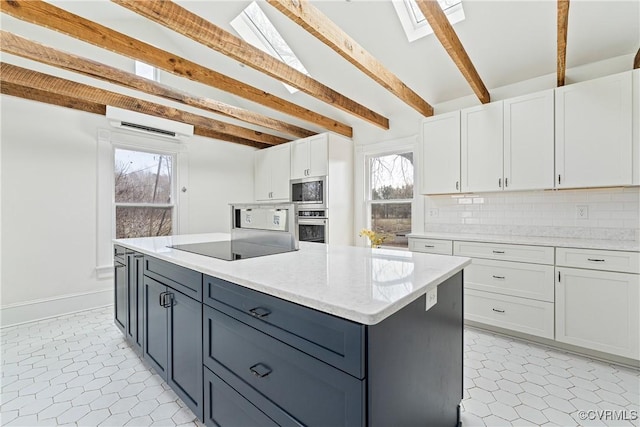 kitchen with stainless steel appliances, a wall mounted air conditioner, white cabinets, and tasteful backsplash