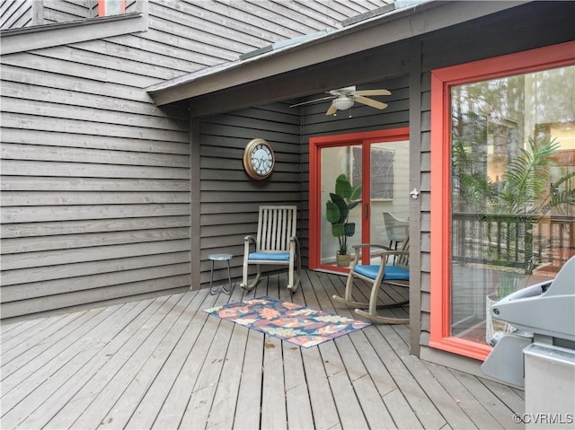 wooden terrace featuring ceiling fan