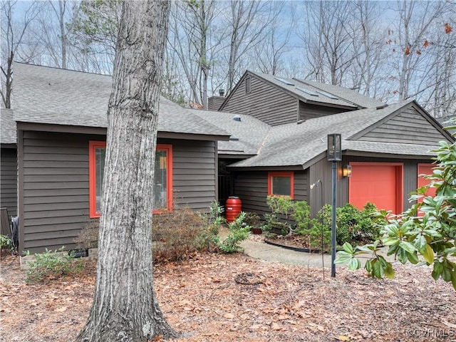 view of front facade with a shingled roof