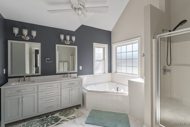 full bathroom with lofted ceiling, a garden tub, a sink, and a stall shower