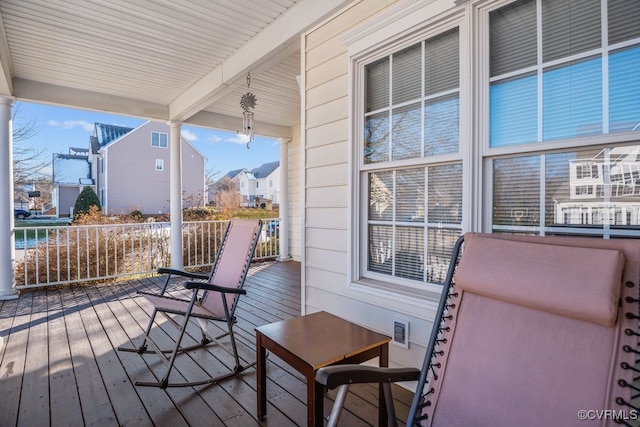 wooden terrace featuring a porch