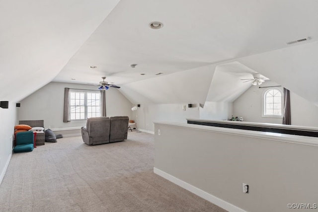 bonus room featuring light colored carpet, visible vents, plenty of natural light, and baseboards