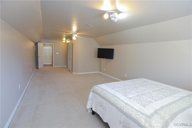 bedroom with vaulted ceiling, light carpet, visible vents, and baseboards